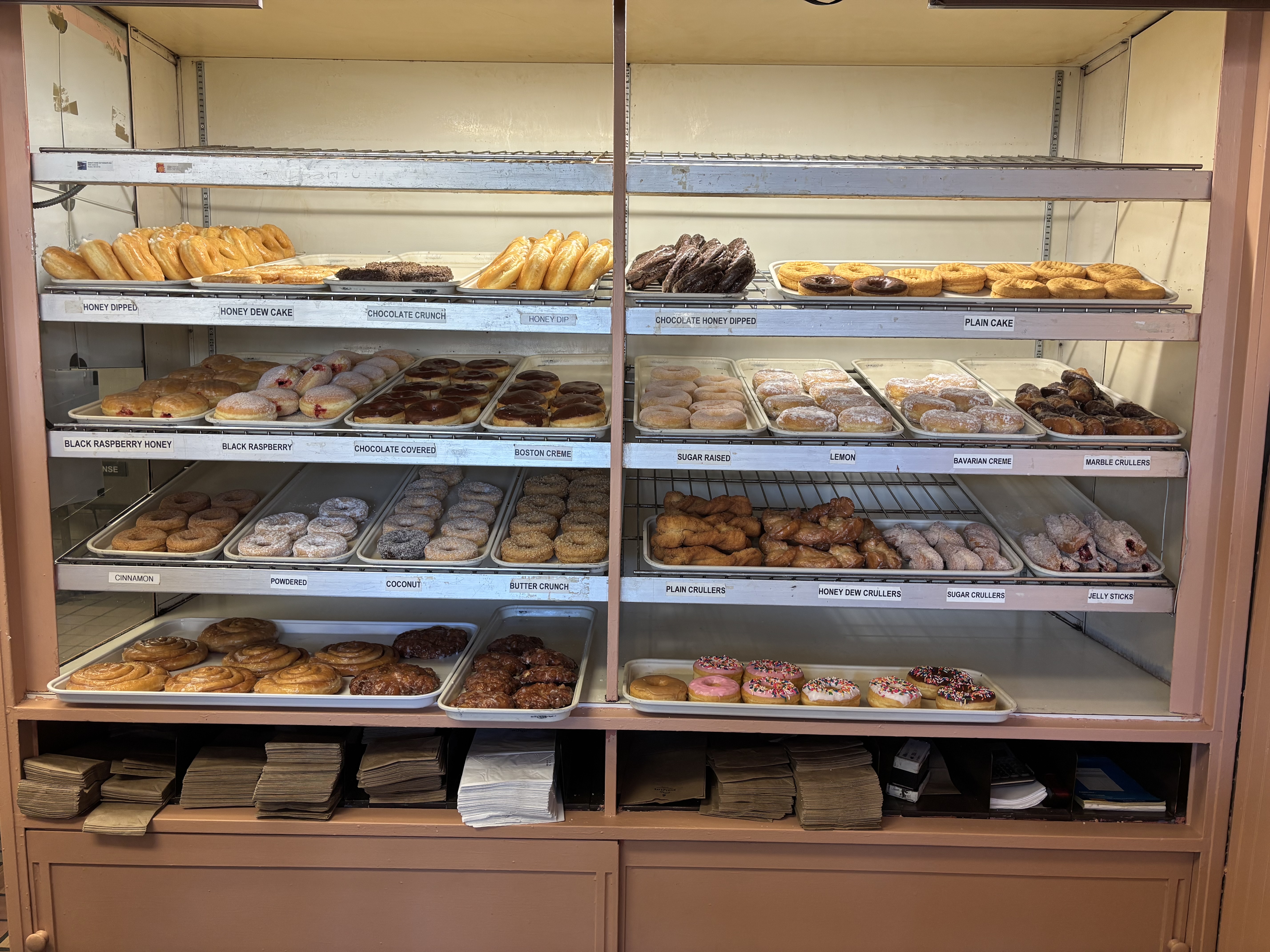 Fresh hand cut donuts on display